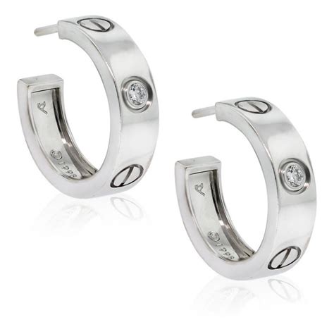 cartier love earrings white gold.